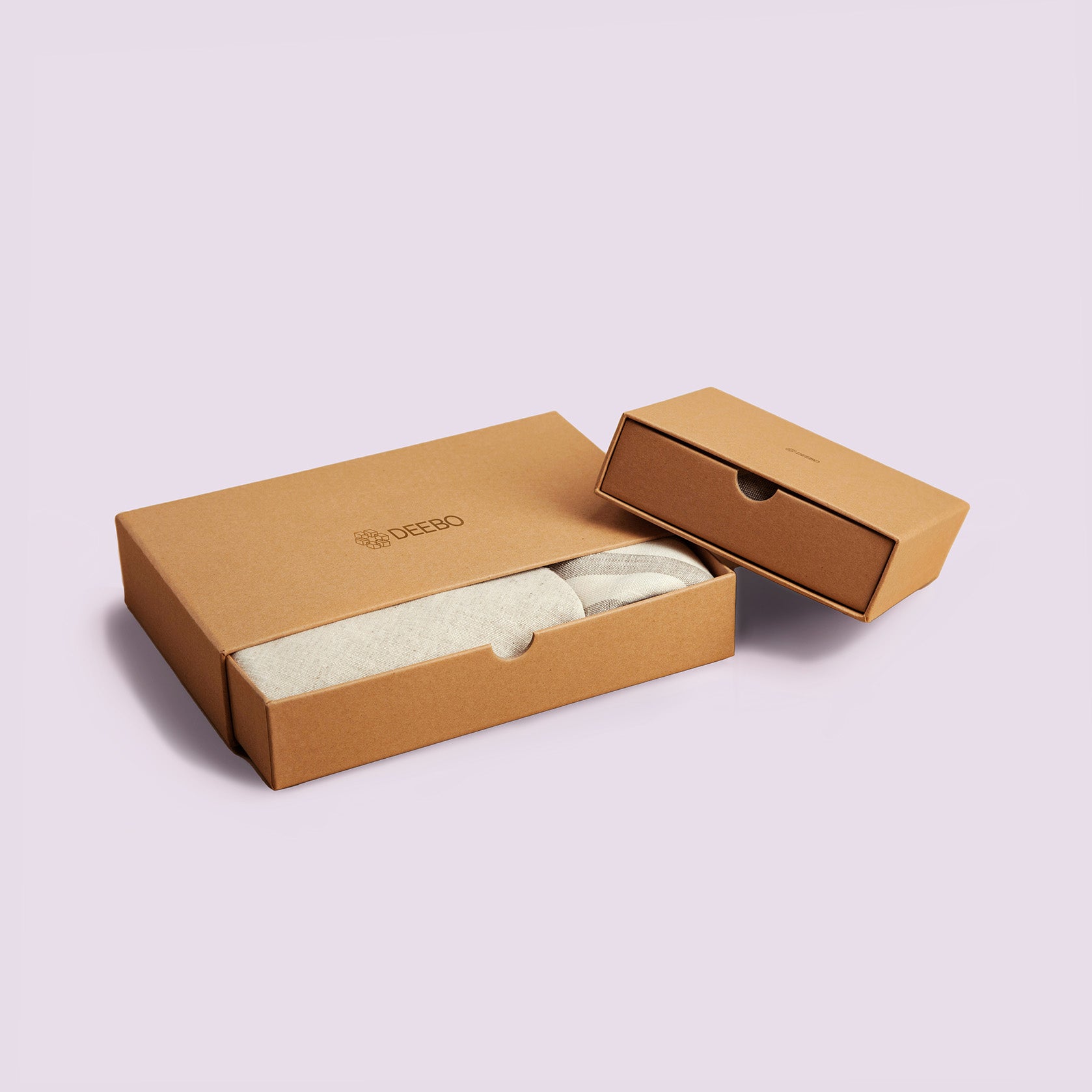 Two minimalist brown cardboard boxes with a smooth, clean design are displayed against a light-coloured background. Both boxes are branded with the "DEEBO" logo.