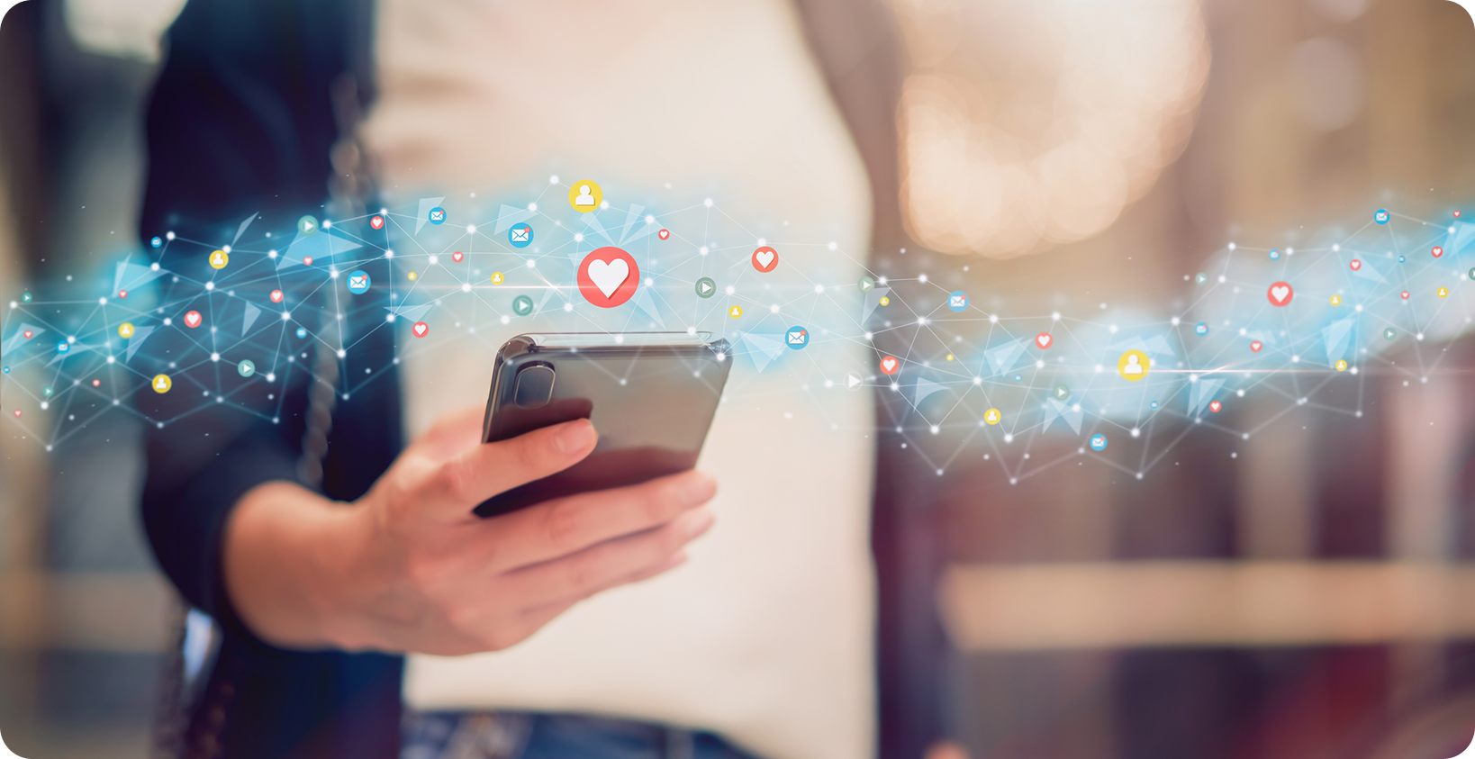 A girl holding a phone, with hologram of icons in the background