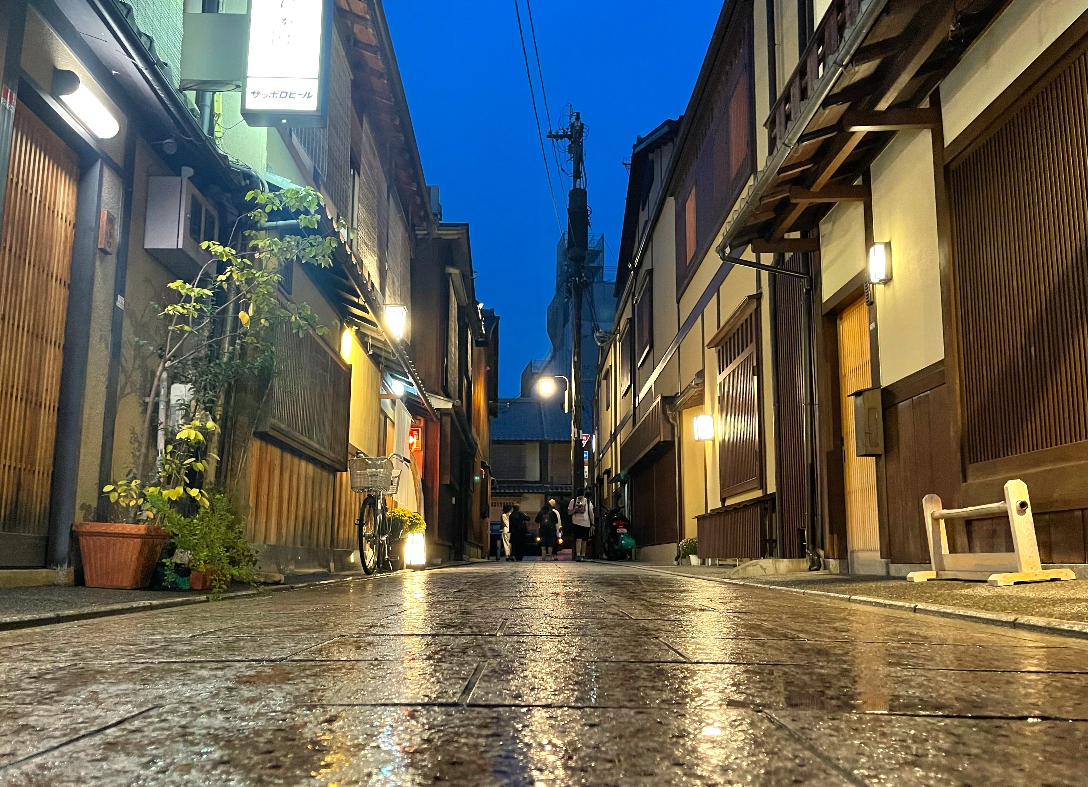 Charming streets of Kyoto at night, showcasing the city's cultural beauty.